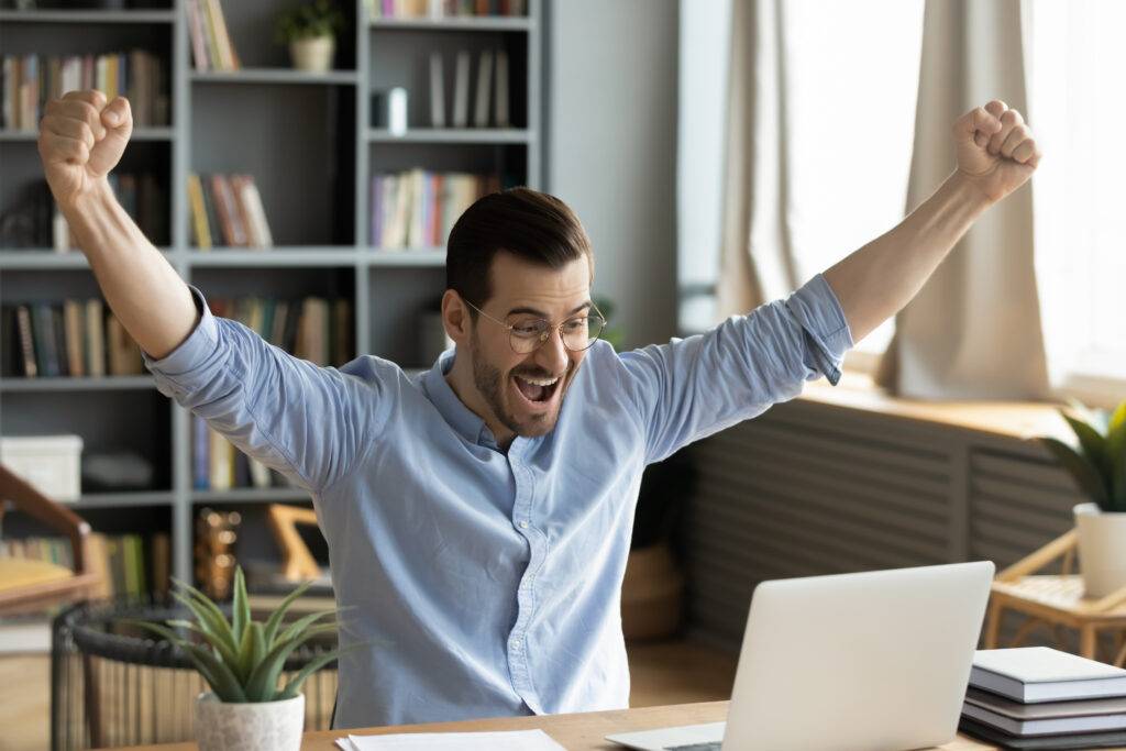 A man celebrates passing an exam.