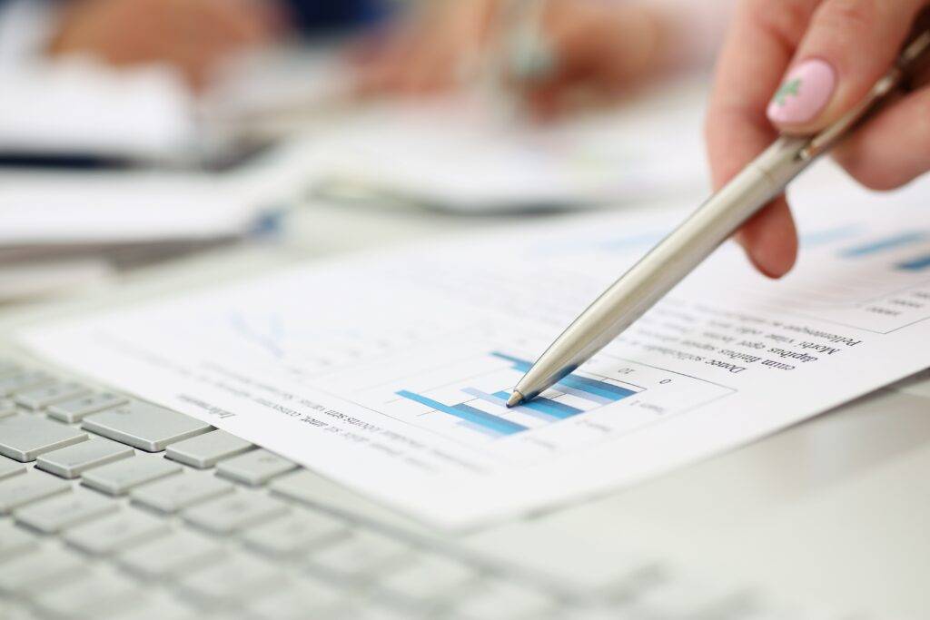 A pen calls attention to a line item on a business document.