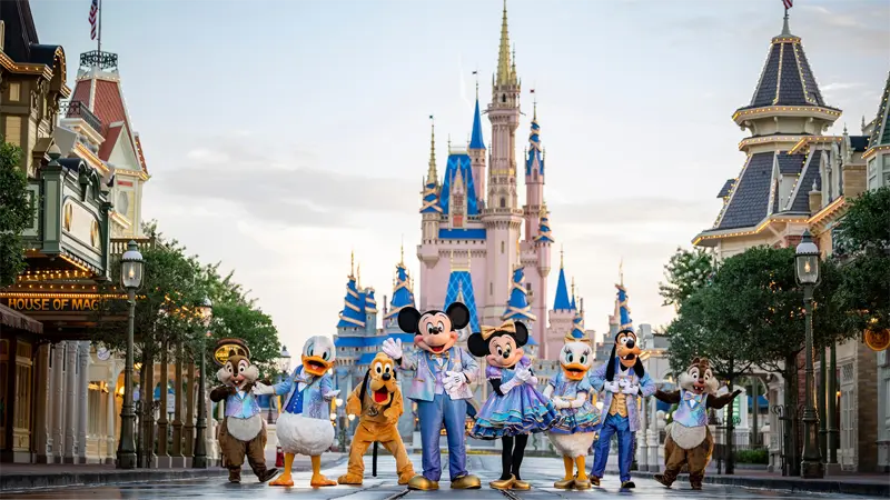 Disney characters in front of Cinderella's Castle at Disney World