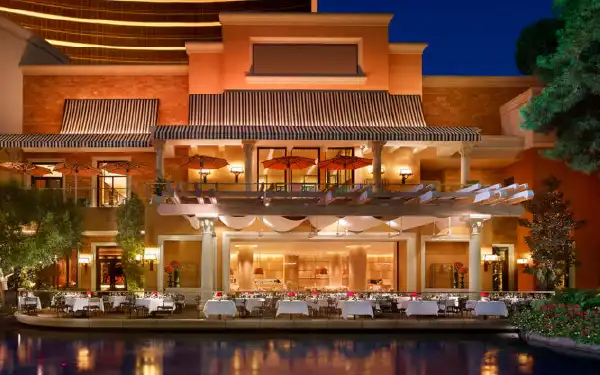 Restaurant with beautiful lights and outdoor seating at night