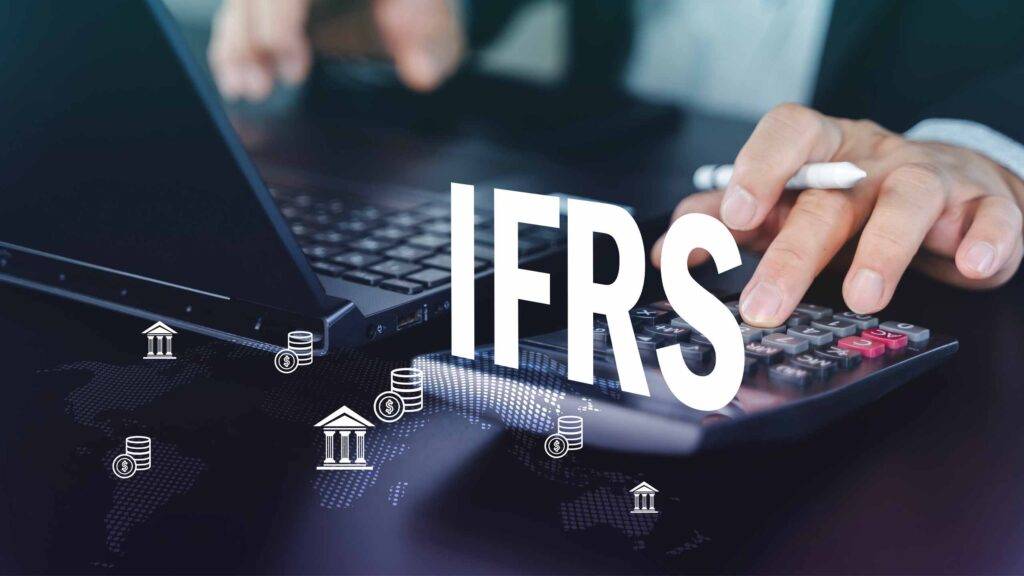Man using calculator next to text reading IFRS